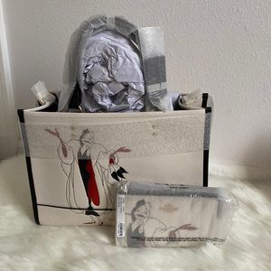 Disney X Coach Dempsey Carryall With Cruella Motif & matching wristlet
